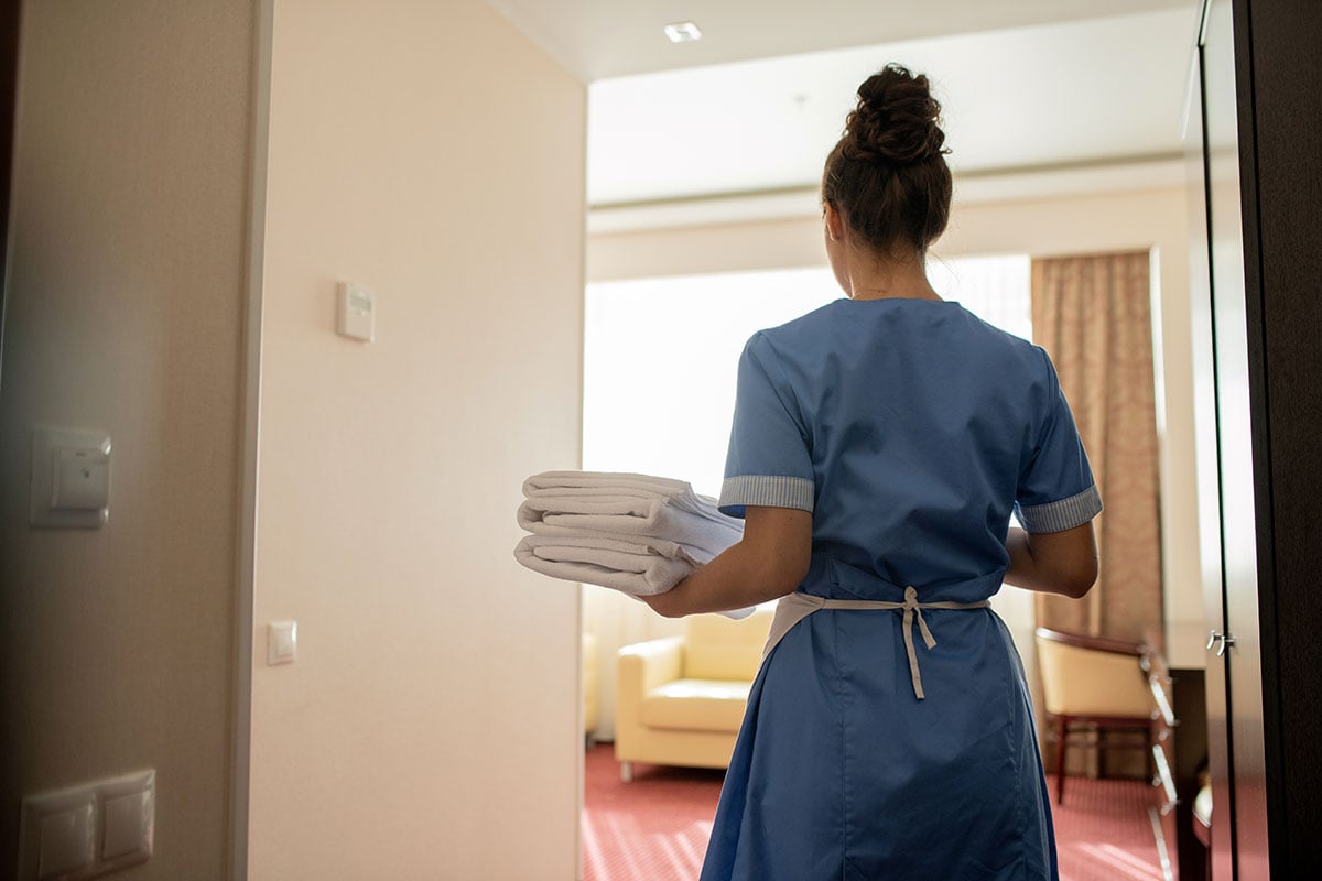 hotel housekeeper working alone